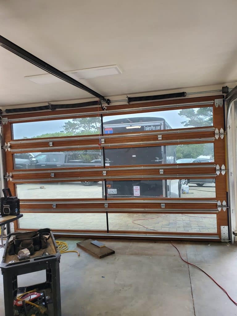 Interior look at custom wood garage door install in Pebble Beach