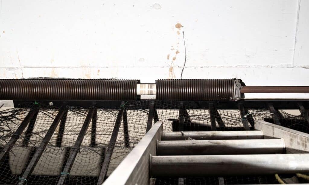 Broken torsion spring with a clean split in the coils